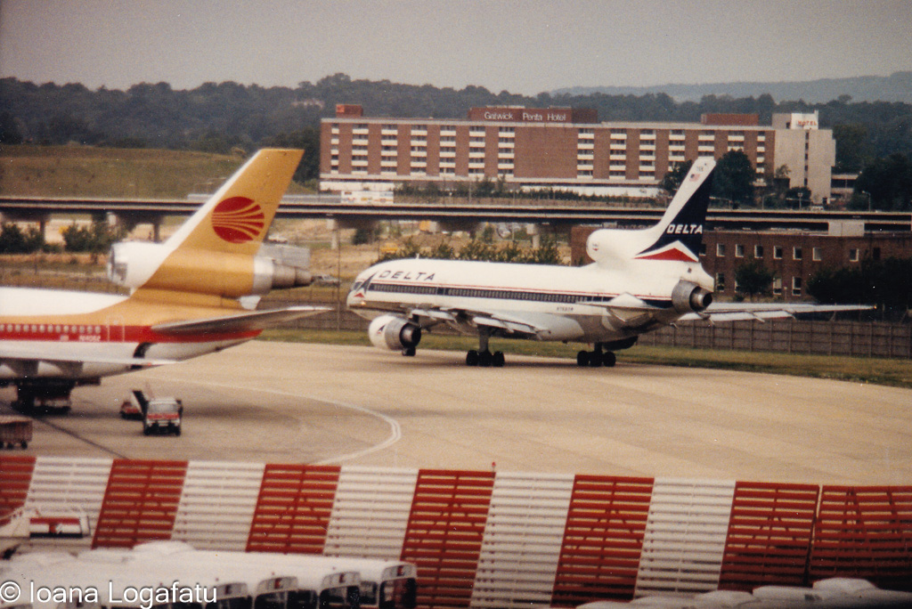 Vintage aircraft on a bustling airport tarmac