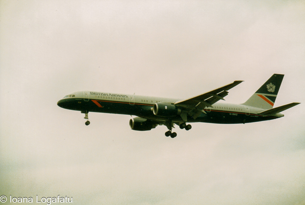 Plane gliding through clouds over city