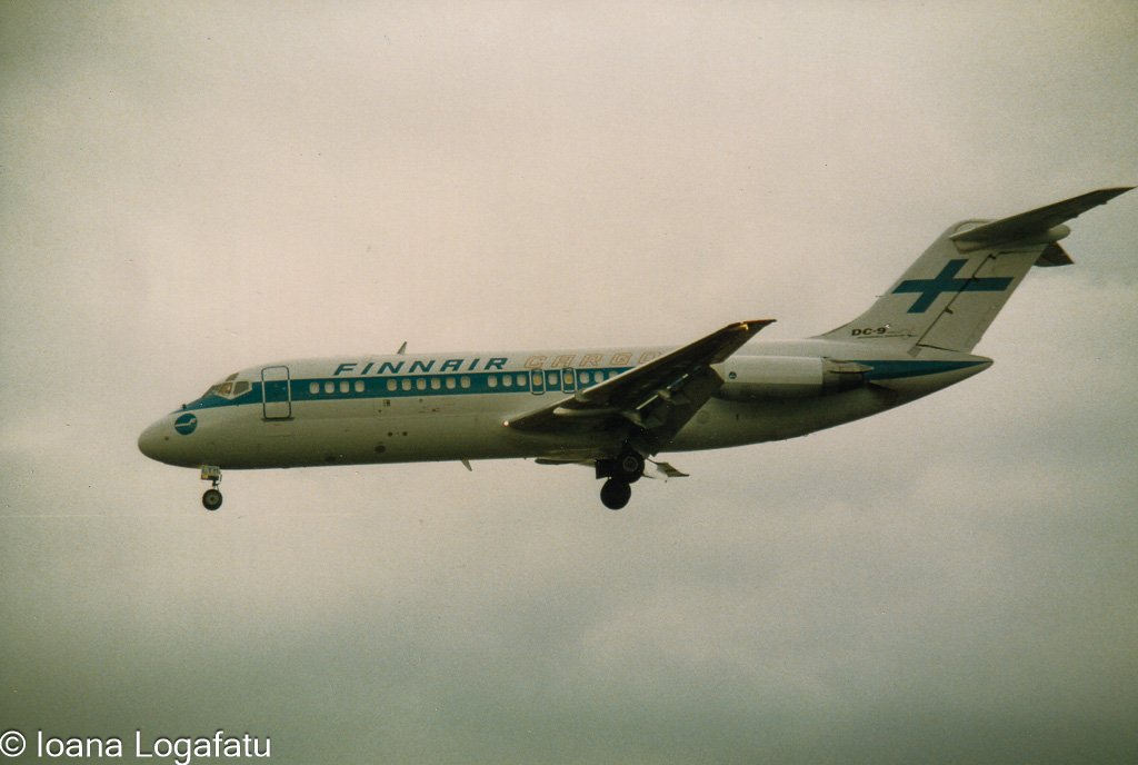 Vintage aircraft approach over cloudy skies