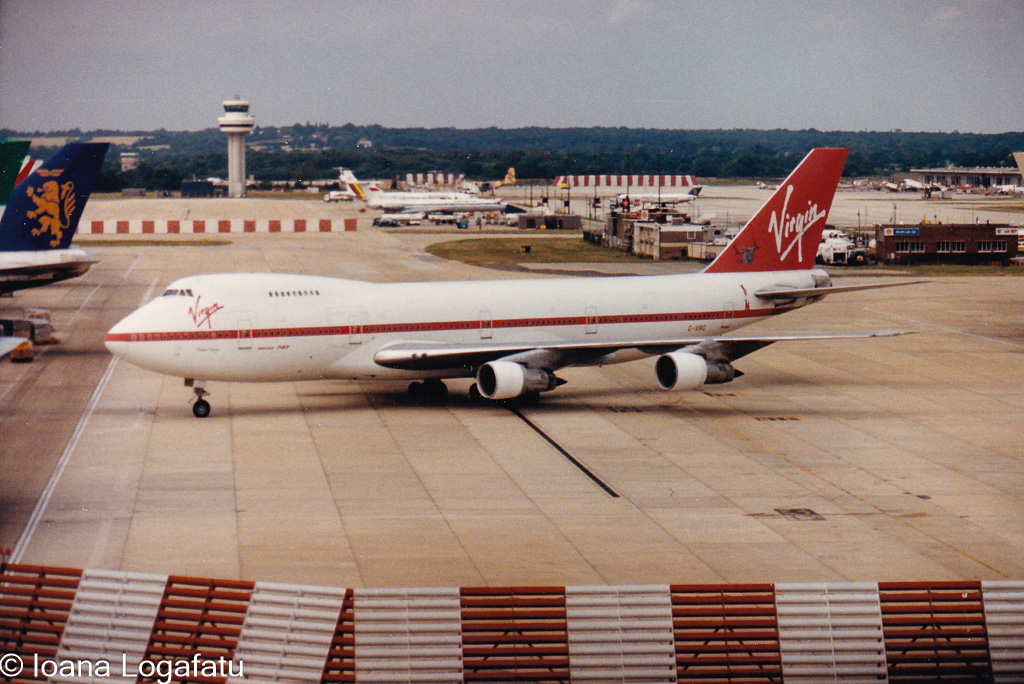 Classic airliner taxiing on a bustling runway