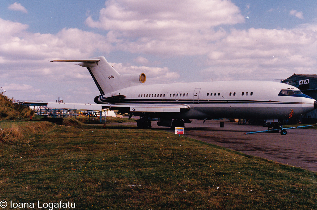 Vintage aircraft parked on a sunny runway