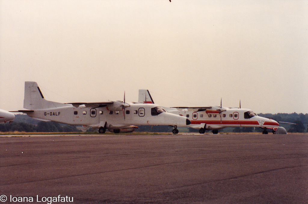 Vintage aircraft parked at the local airfield