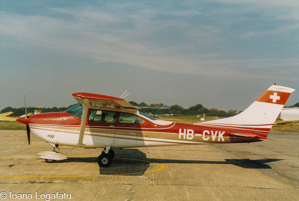 Vintage Swiss airplane parked at an airport