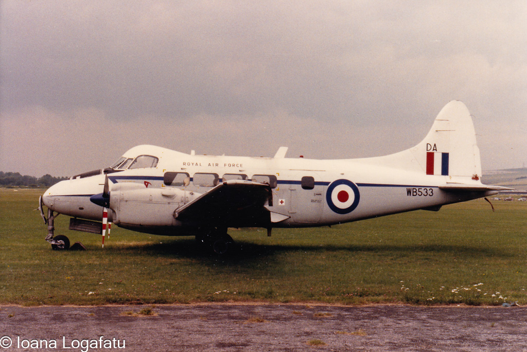 Historic planes at an overcast airfield
