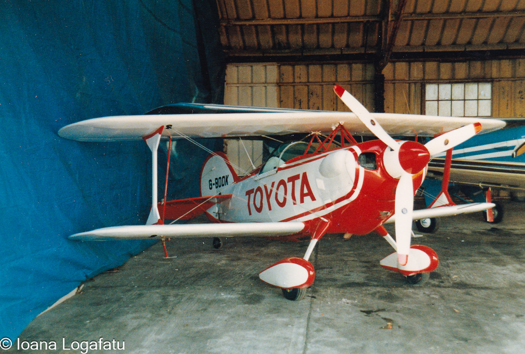 Vintage biplane showcased in a hangar space