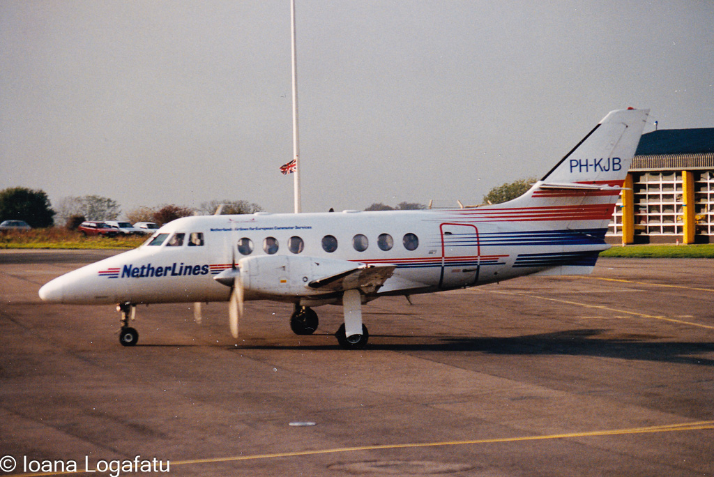Vintage aircraft parked on the tarmac at sunset