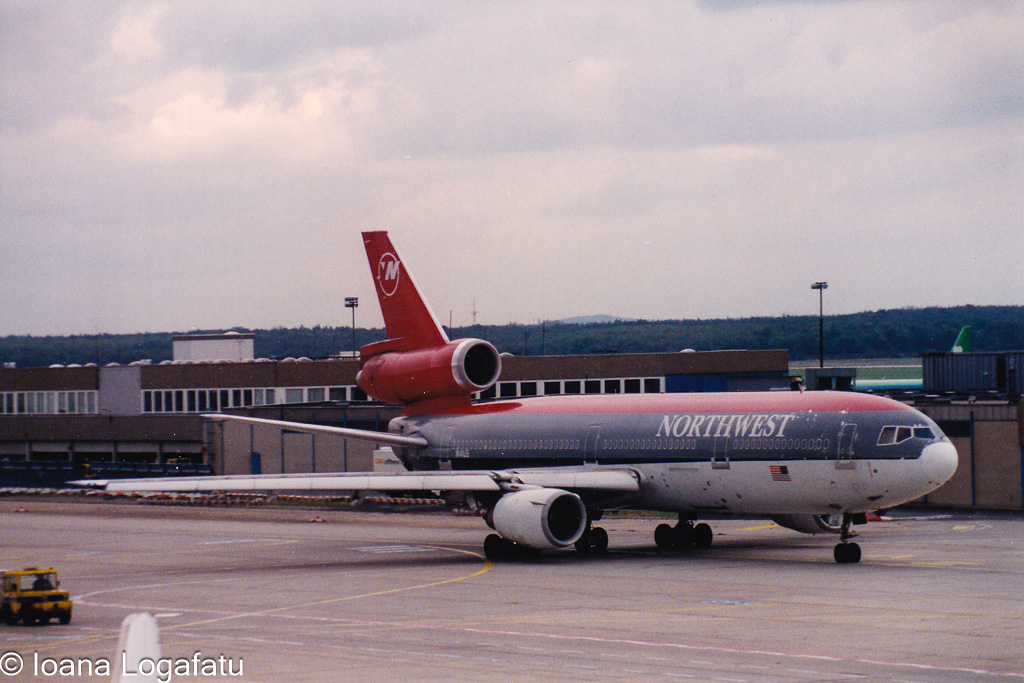Historic airplane at the bustling airport terminal