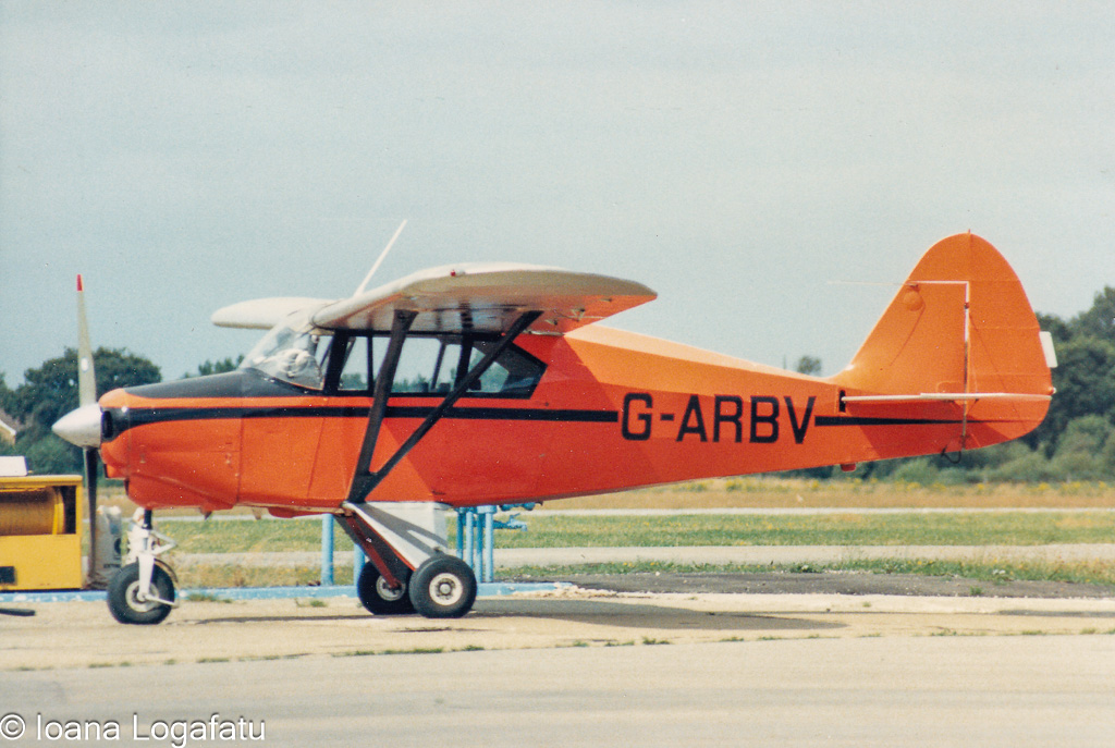 Orange vintage plane ready for takeoff