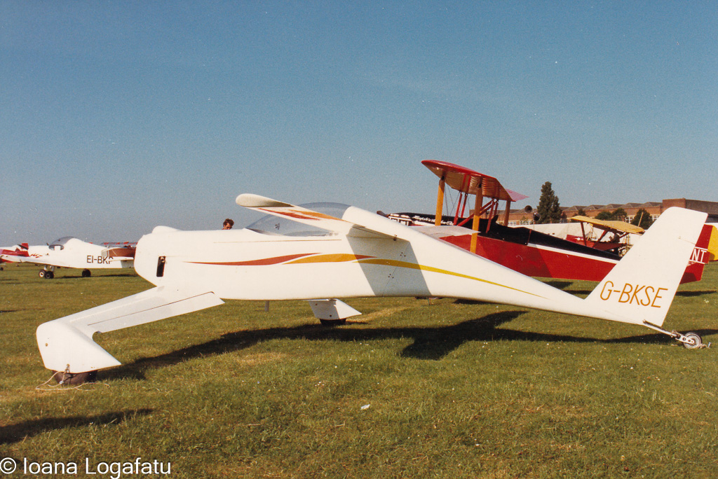 Vintage aircraft on display at a sunny airfield