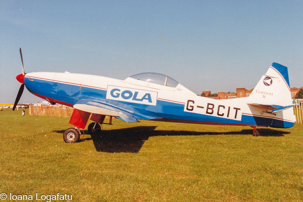 Vintage aircraft rests under a clear blue sky