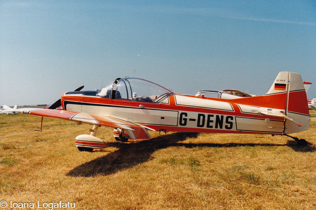 Vintage aircraft resting on a sunlit runway
