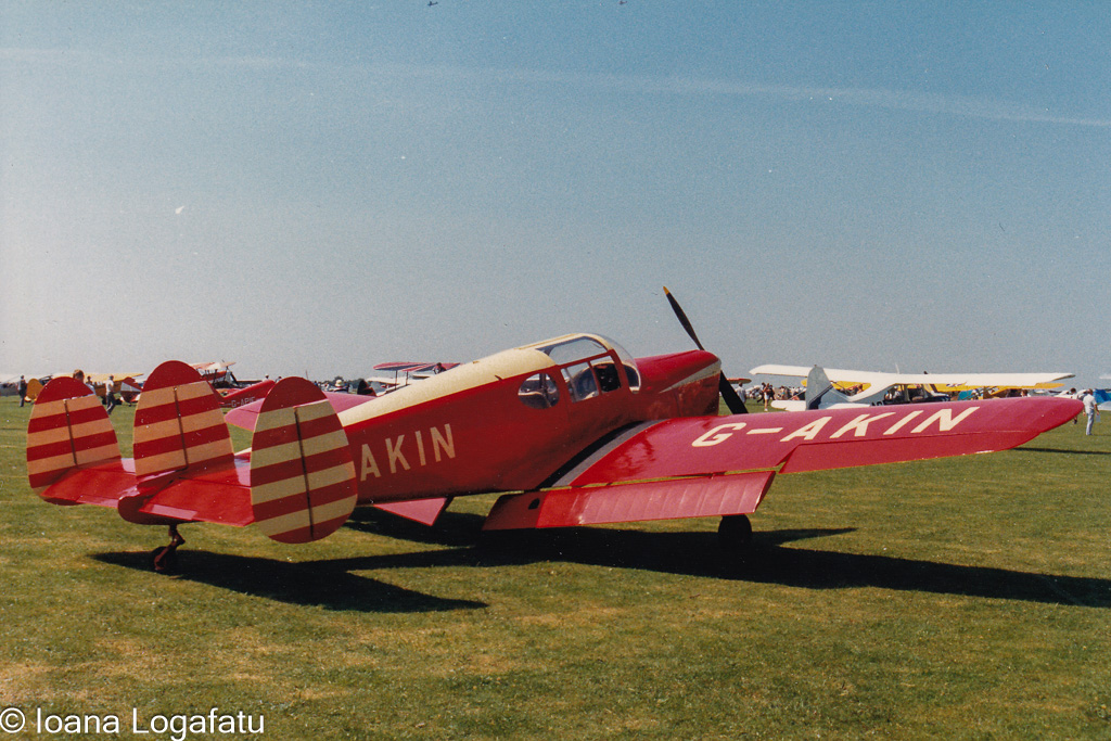 Vintage aircraft shines under the bright blue sky