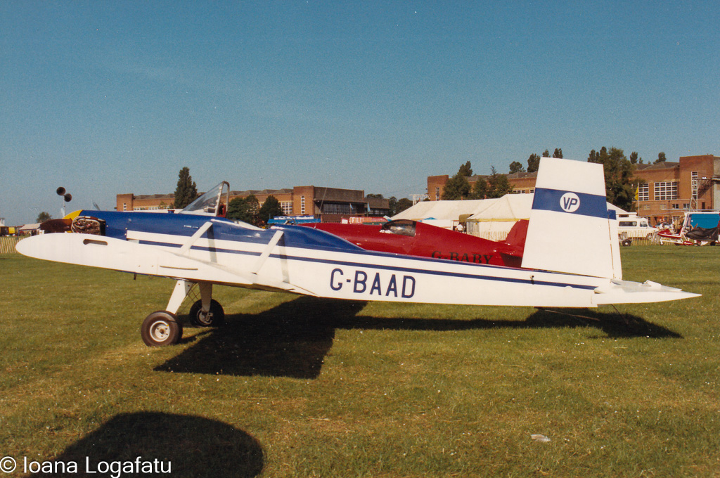 Vintage aircraft parked on a sunny day