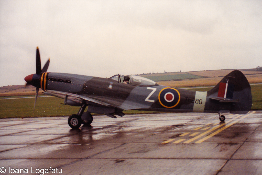 Vintage aircraft stands ready on the runway