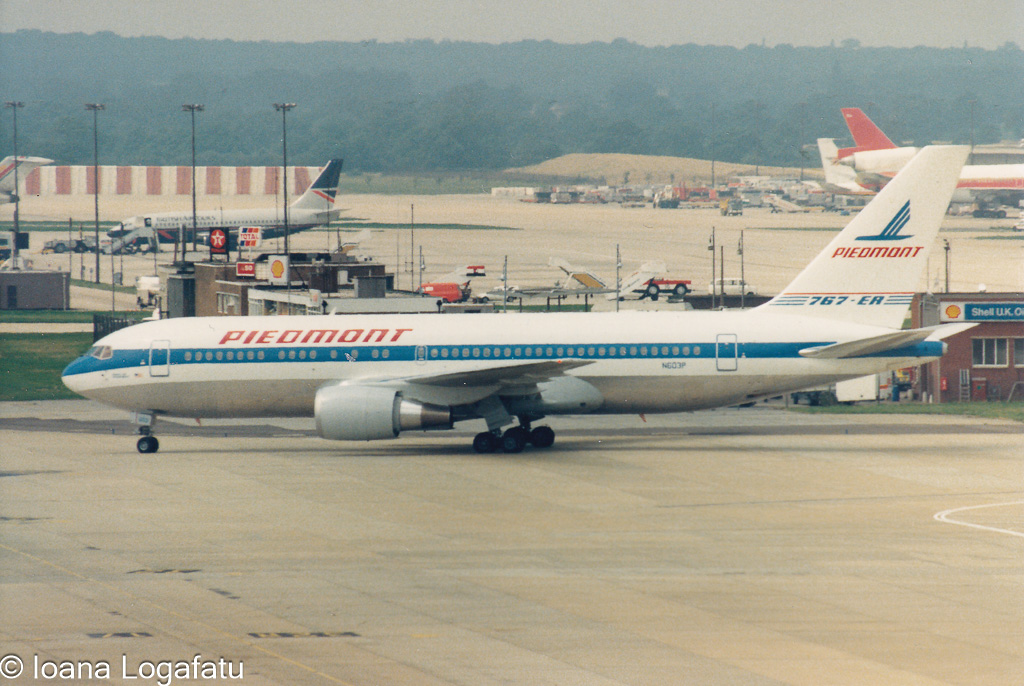Vintage airliner taxiing at historic terminal