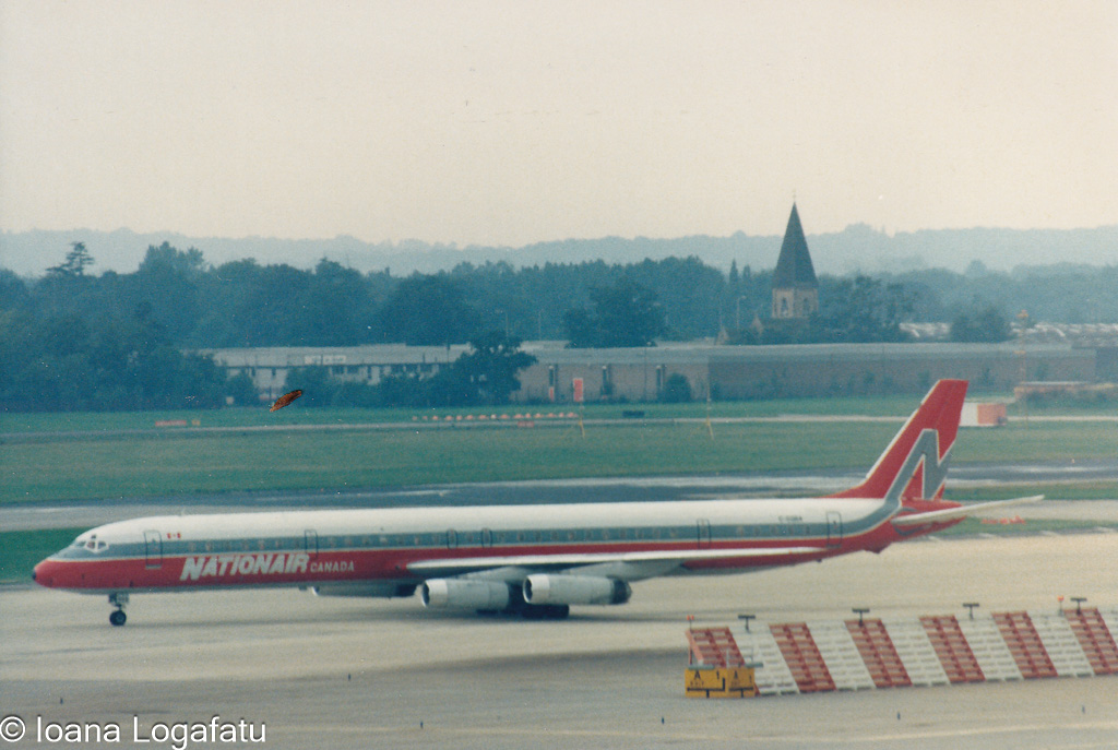 Historic airplane taxiing at the airport terminal