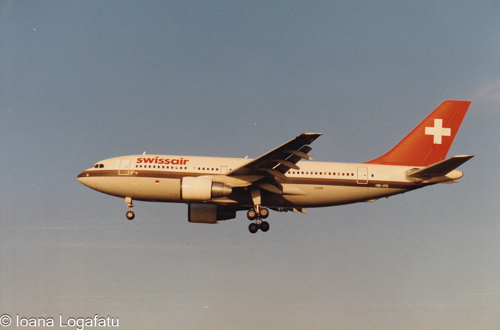 Swissair aircraft preparing for landing at sunset