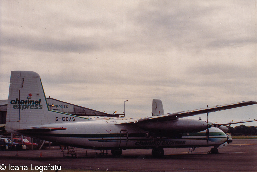 Vintage aircraft parked at the airport terminal