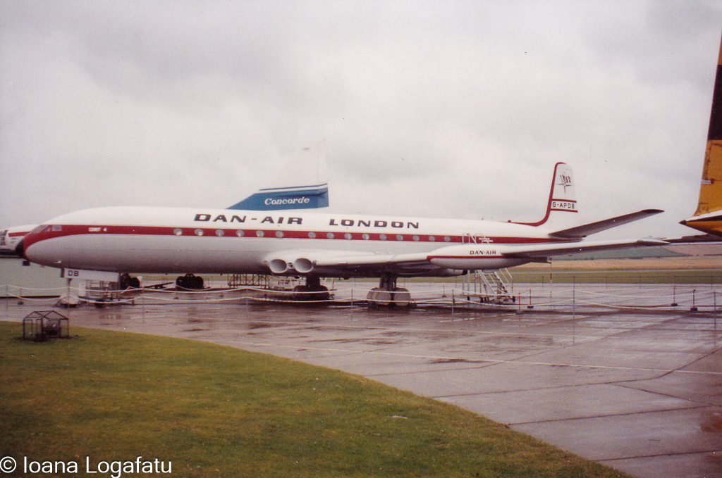 Historic plane at a rainy airport