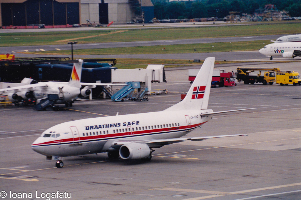 Airliners at a busy sunny terminal
