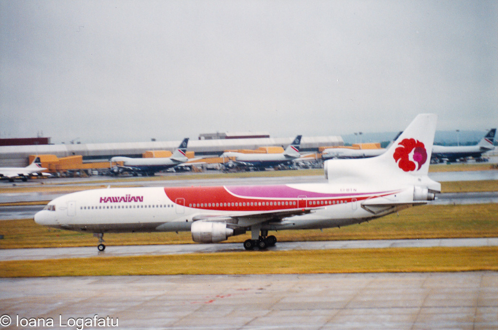 Colorful jet departs busy airport runway