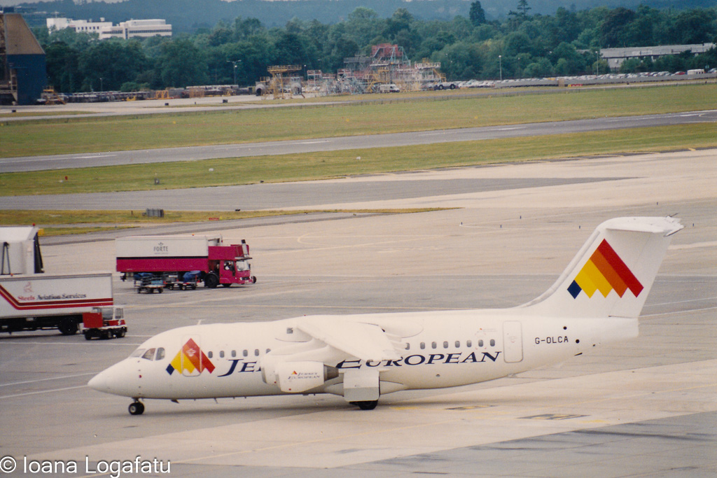 Vintage planes on runway at busy airport