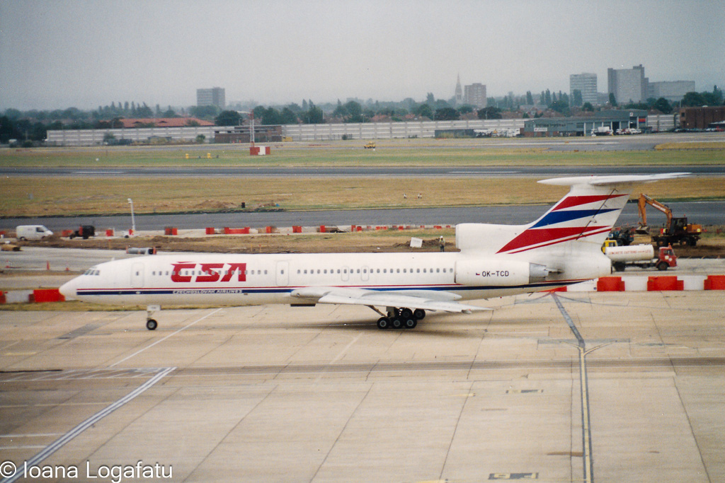 Colorful aircraft taxiing on a busy airport runway