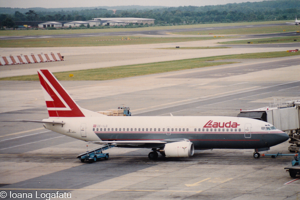 Vintage aircraft at the bustling airport terminal