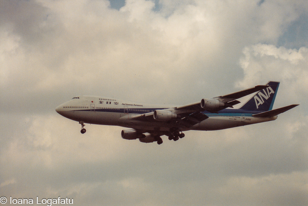 Airplane soaring through clouds
