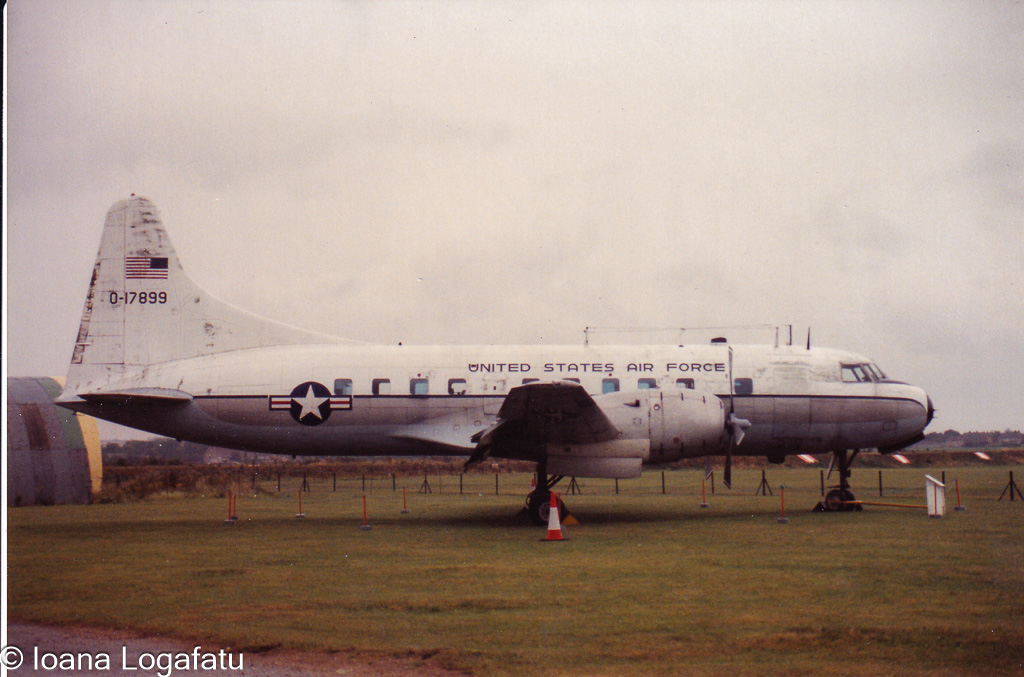Historic aircraft on display in an open field