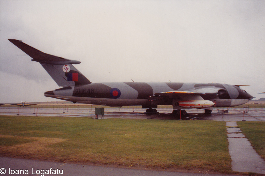 Vintage military aircraft displayed on cloudy day