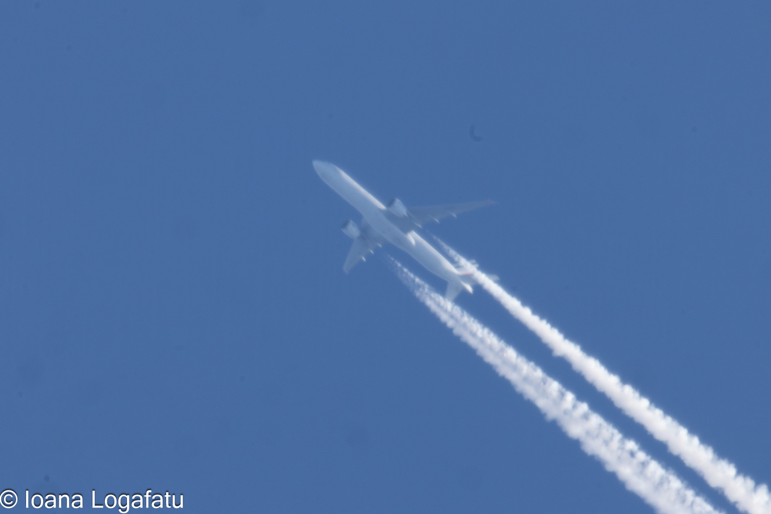 Airplanes soaring in clear blue sky