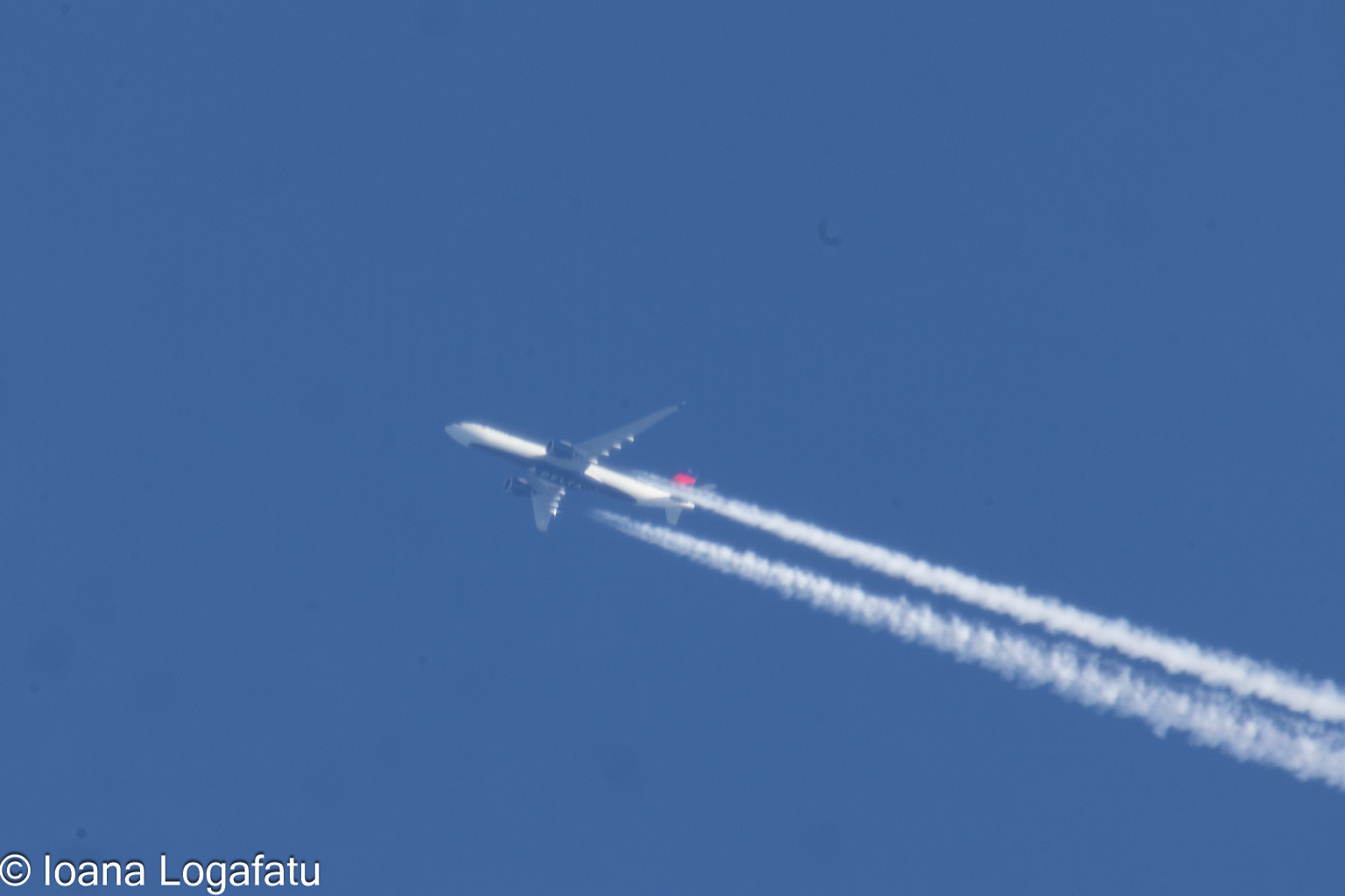 Jet soaring through a clear blue sky