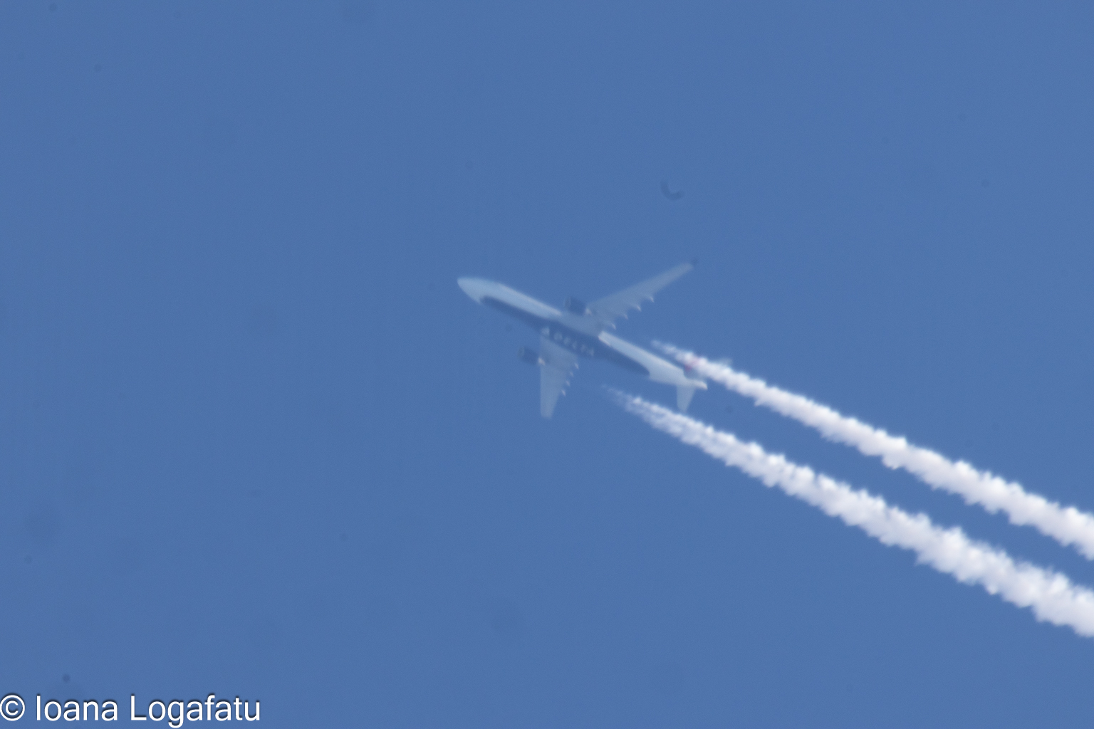 High above the clouds, a plane journeys onward
