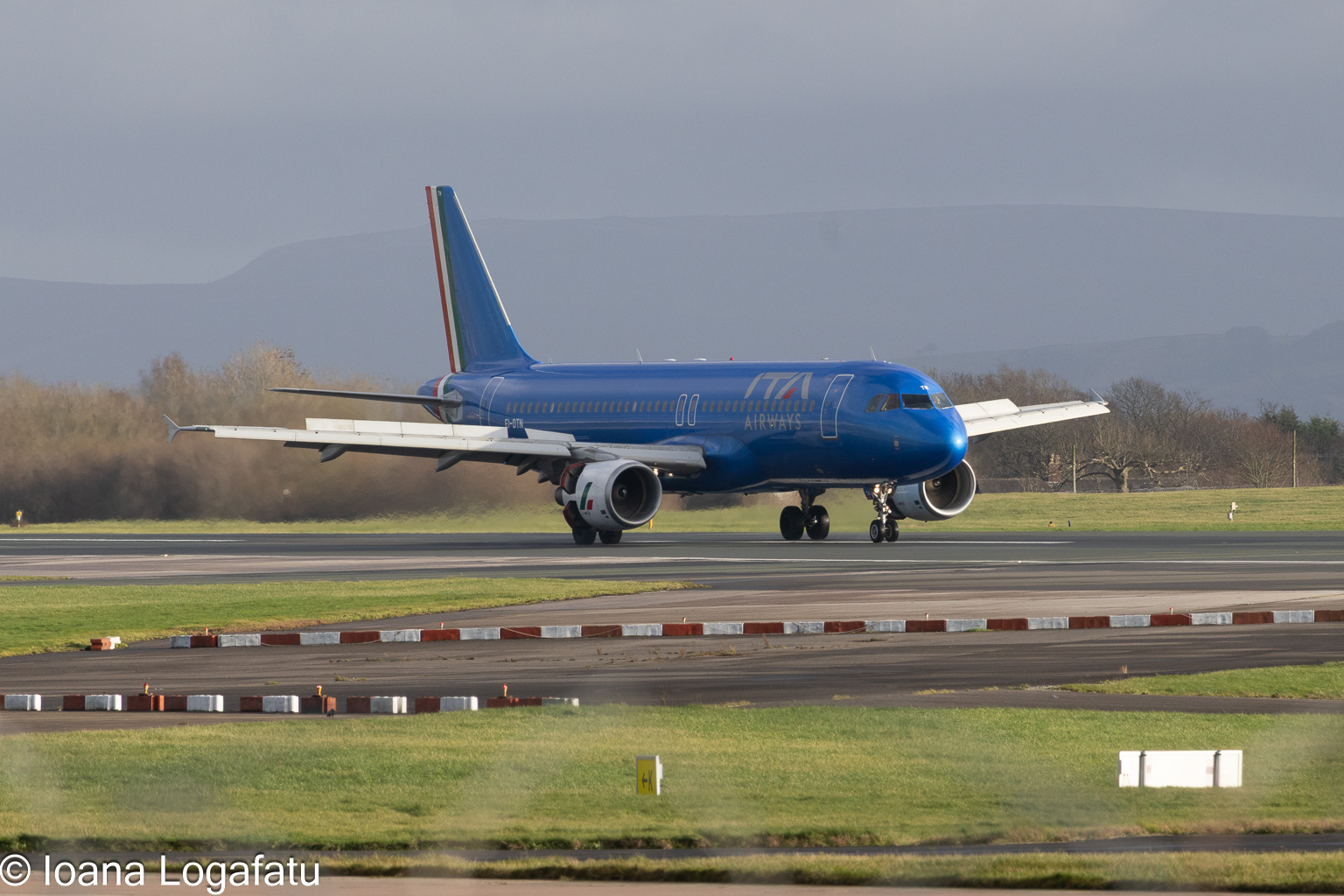 Airplane taxiing on a sunny day at the airport