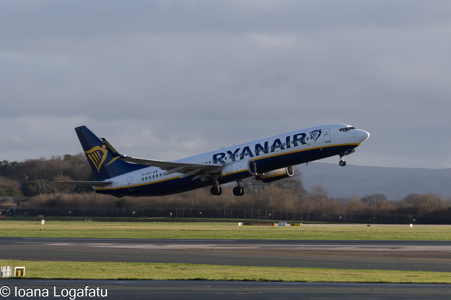 Ryanair flight takes off into the cloudy sky