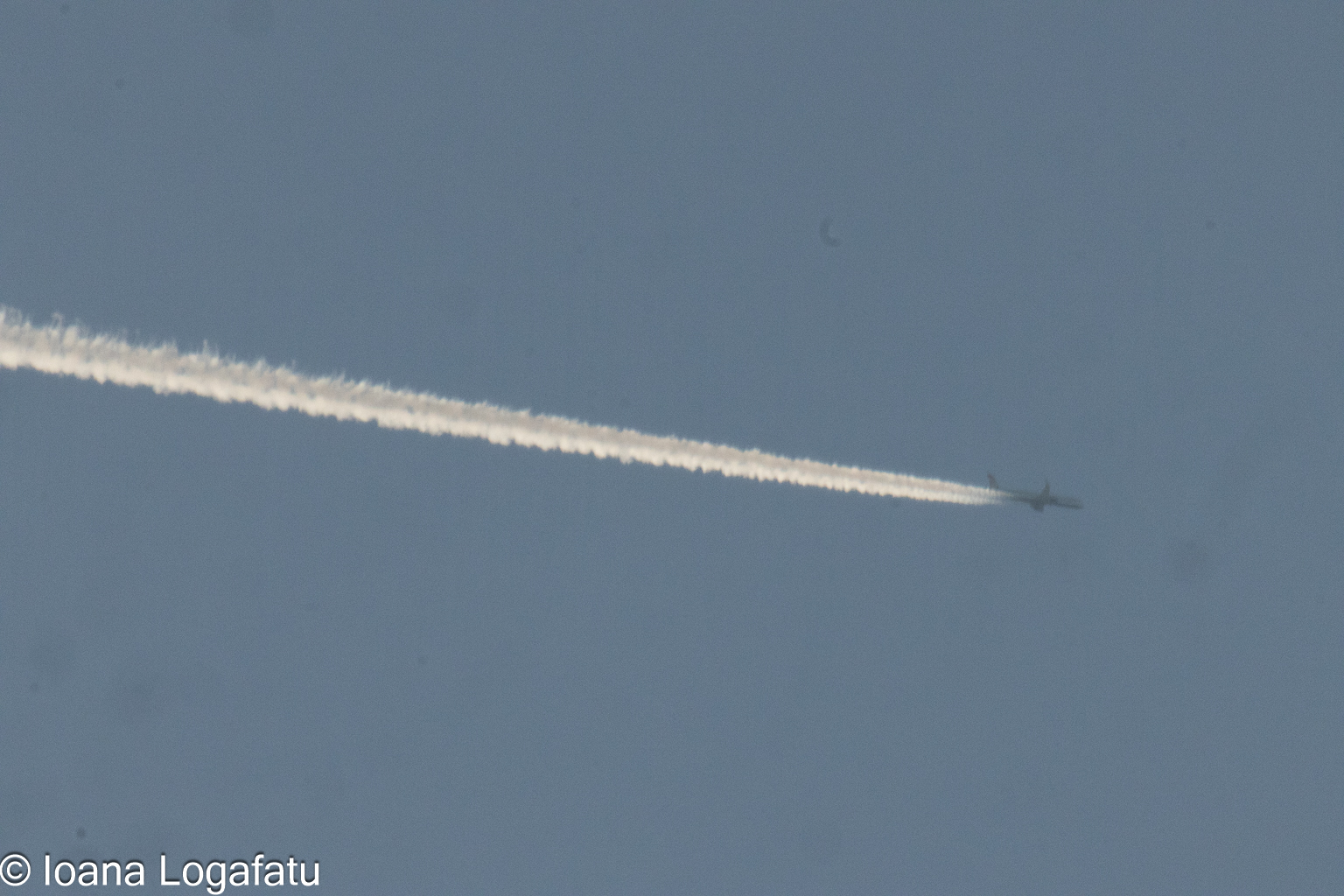 Soft trails across the bright blue sky