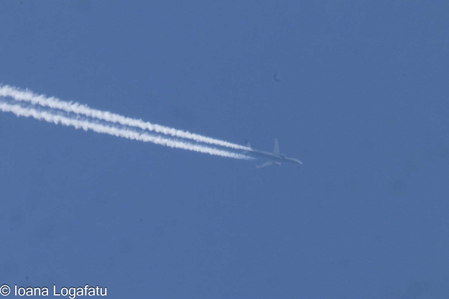 Jet soaring through a clear blue sky