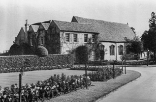 Historic building amid lush gardens