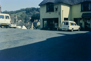 Vintage village corner with classic cars in view