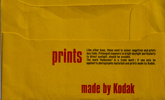 Bright yellow envelope containing color prints