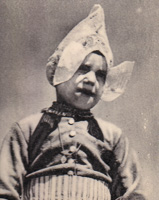 Child in traditional headwear outdoors