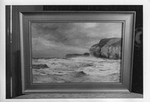 Ocean waves crashing against rugged cliffs