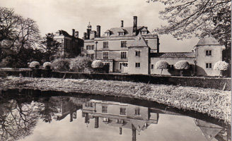 Reflections of an elegant mansion by the water