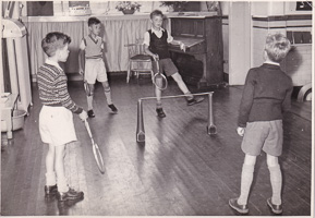 Boys play a friendly game in an old gym