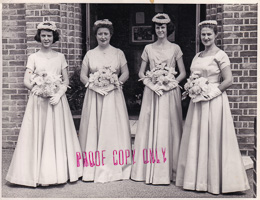Elegant bridesmaids in vintage attire at a wedding