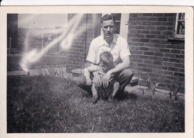 Memorable moment of a father and son in the yard