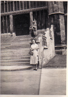 Woman standing near historic building steps