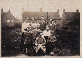 Family gathering in a historic garden setting