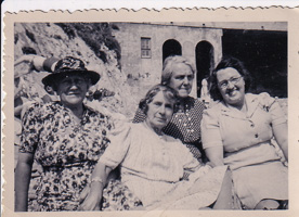 Four women enjoying a sunny day at the beach